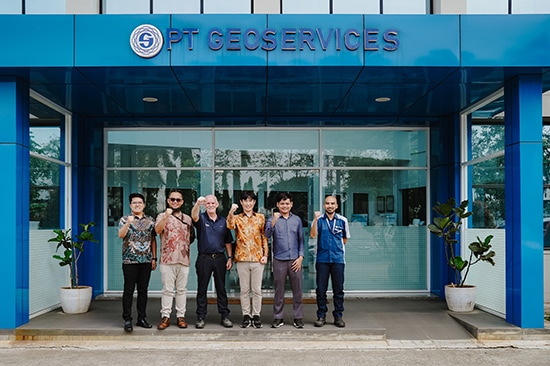 Group photo of representatives from PT. Hitachi High‑Tech Indonesia and PT Geoservices following the successful handover of the SU3900 SEM with AMICS system at PT. Geoservices GeoAssay Laboratory.