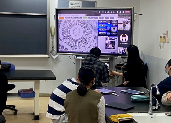 Students showing interest in the geometric patterns of diatom